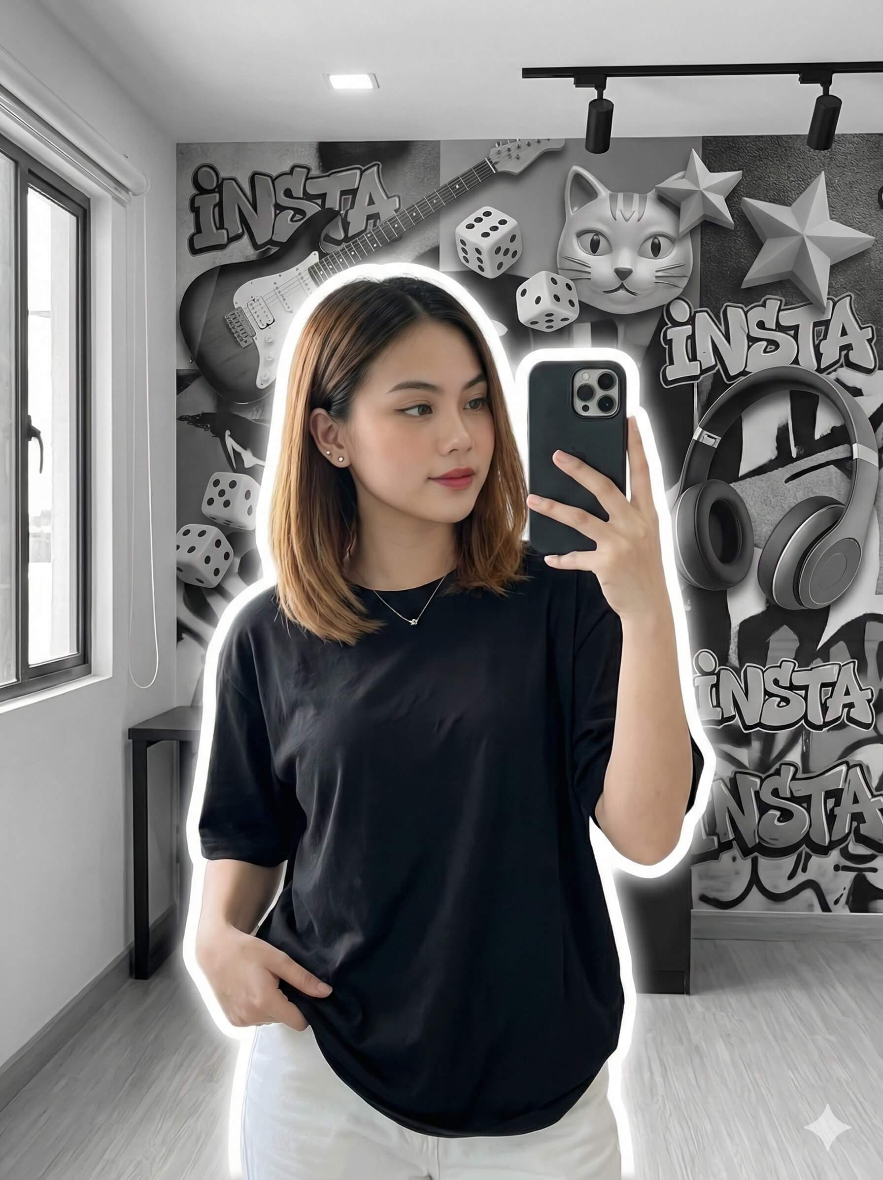 Gemini Generated Image: A young woman with shoulder-length brown hair is taking a mirror selfie. She is wearing a black t-shirt and white pants. The background is a black and white graffiti-style wall featuring images of a guitar, dice, a cat, and headphones. There is a glowing white outline around her figure.